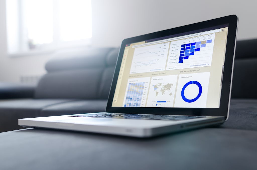 Laptop Displaying Data Analytics for Best CRM Software 2025 – Photo by Lukas. Sleek laptop displaying data analytics dashboards and performance graphs related to the Best CRM Software 2025 in a bright, modern workspace.